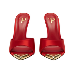 Red high-heeled shoes with gold accents on a white background