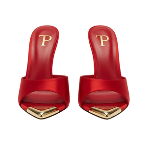 Red high-heeled shoes with gold accents on a white background