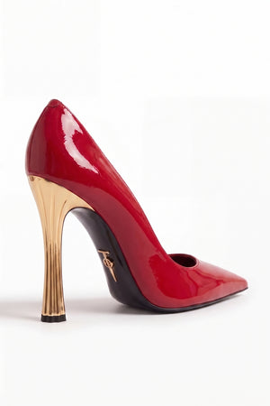 Red high-heeled shoe with gold heel on a white background