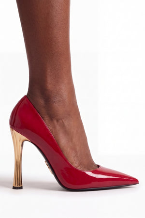Red high-heeled shoe on a white background